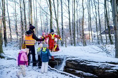 Students learning new skills in Forest School.