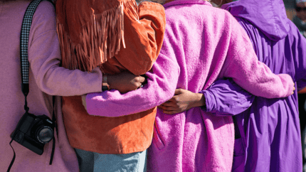 Women holding each other 