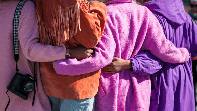 Women holding each other 
