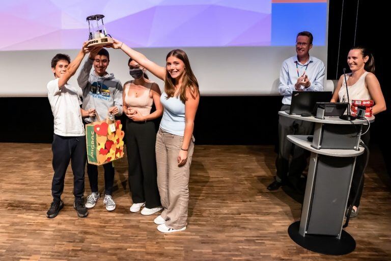ISL winning scientific group raising their trophy