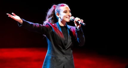 Student on stage during the production of 