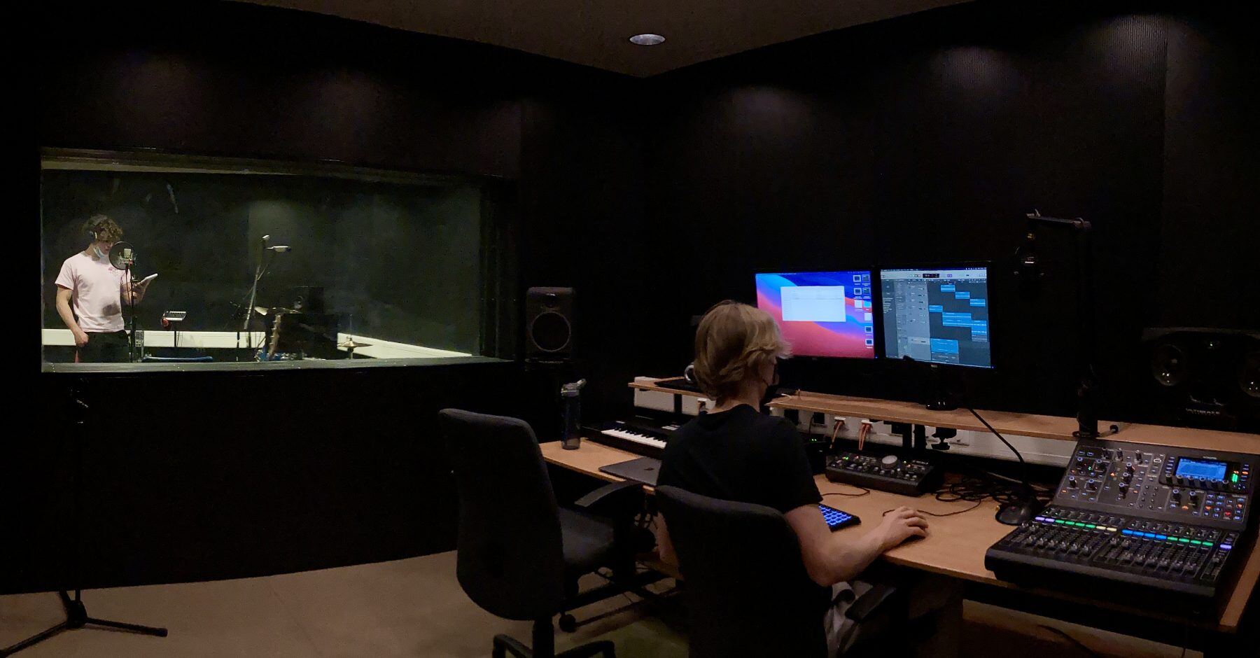 Two ISL Students recording in a music studio