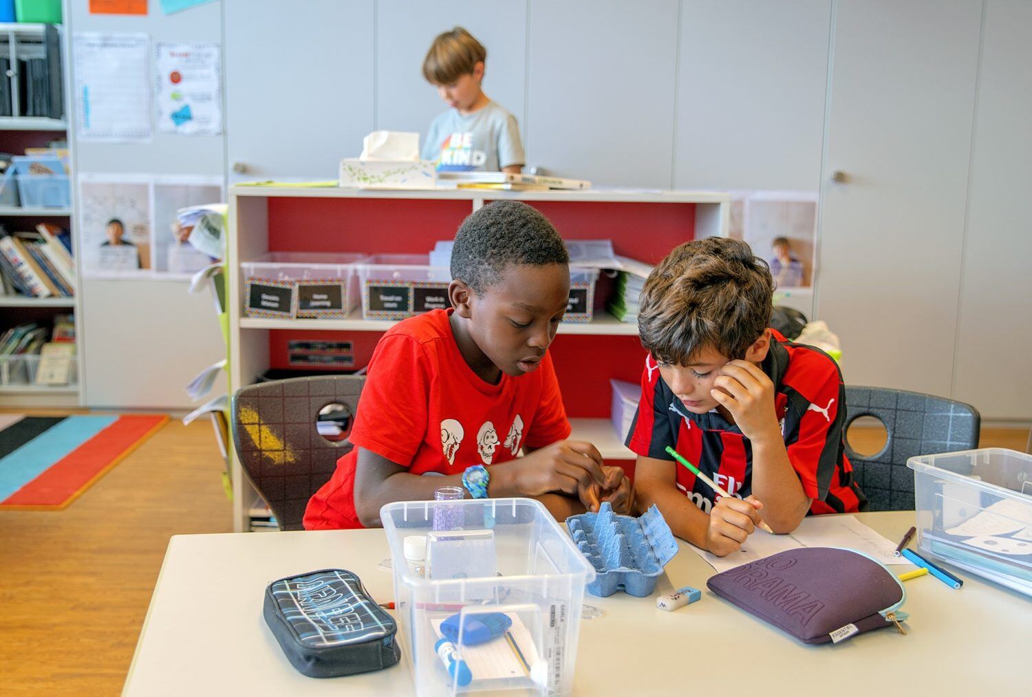 Two students learning at ISL